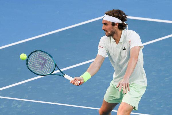 MELBOURNE, AUSTRALIA - JANUARY 11: Stefanos Tsitsipas of Greece plays against Novak Djokovic of Serbia during a charity match ahead of the 2024 Australian Open at Melbourne Park on January 11, 2024 in