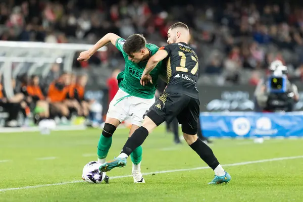 Stock image MELBOURNE, AUSTRALIA - MAY 24: Ben Parkinson of Newcastle United competes with Benjamin Garuccio of A-League All Stars Men during the Global Football Week at Marvel Stadium on May 24, 2024 in