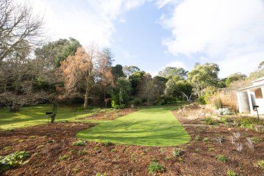 BLACKWOOD, AUSTRALIA - JULY 28 2024: The Garden of St Erth plant nursery on a cool late winter morning in Blackwood, Victoria, Australia clipart