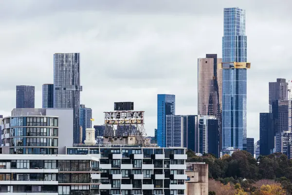 stock image MELBOURNE, AUSTRALIA - JUNE 10, 2022: View towards Melbourne skyline and the iconic Nylex Clock sign from a high rise building in Cremorne in Australia