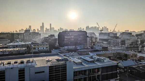 stock image MELBOURNE, AUSTRALIA - JULY 31, 2024: View towards Melbourne skyline from a high rise building in Cremorne on a cold winters afternoon in Australia