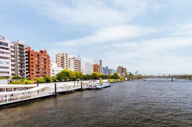 Sumida River from Azuma Bridge on a clear spring day in Azumabashi district of Sumida City in Tokyo, Japan clipart