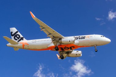 MELBOURNE, AUSTRALIA - SEPTEMBER 07, 2024: A Jetstar Airbus A320 flies into Melbourne from Sydney on September 7th 2024 clipart