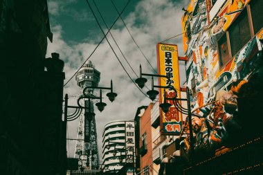 OSAKA, JAPAN - SEPTEMBER 26 2024: The famous Shinsekai area with Tsutenkaku Tower on a clear autumn day in Osaka, Japan clipart