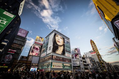 OSAKA, JAPAN - SEPTEMBER 26 2024: The view down Dotonbori River from Ebisubashi Bridge on a clear autumn day in Osaka, Japan clipart