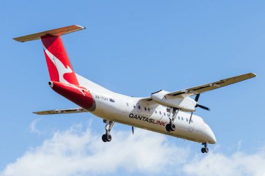 MELBOURNE, AUSTRALIA - SEPTEMBER 07, 2024: A Qantas Bombardier DHC-8-315Q flies into Melbourne on September 7th 2024 clipart