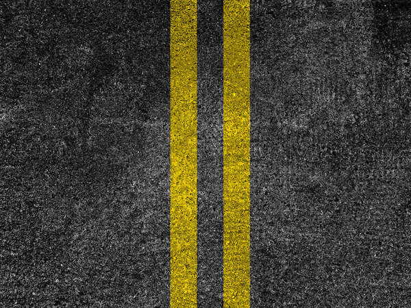 Asphalt road with double yellow lines