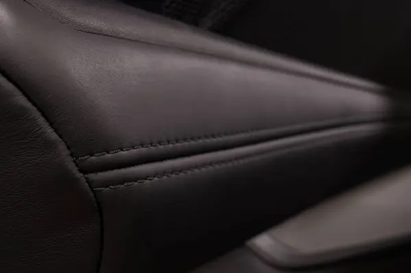 Car interior detail. Abstract leather background. Horizontal photo.