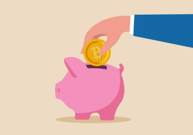 Kripto para biriktirip yatırmak, gelecek için biriktirmek, kripto konsepti yatırmak veya ticaretini yapmak, pembe domuzcuk bankasına koyulan altın bitcoin 'i tutmak..