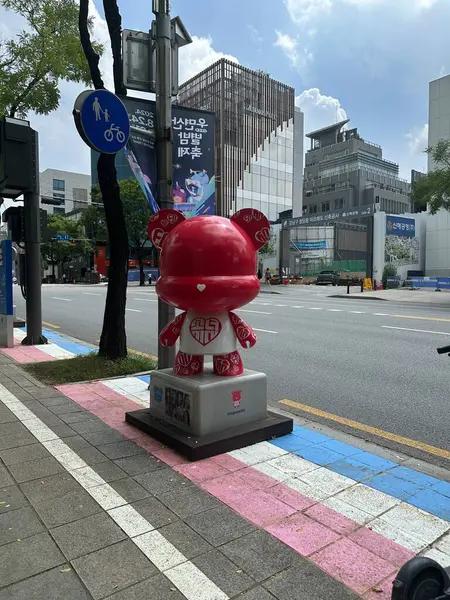 stock image Seoul, South Korea - 10 Aug 2024: Girls Generation sculpture or doll located in Gangnam district in Kpop street. With buildings in background.