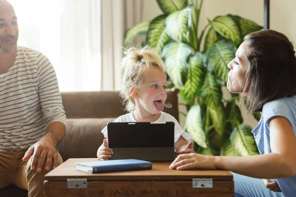While Watching Cartoons Tablet Parents Play Daughter Make Tongues Each — Stock Photo, Image