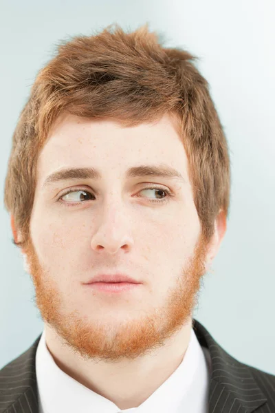 Close Frontal Portrait Young Man Short Red Hair Beard Suspicious — Stock Photo, Image