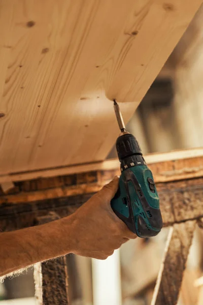 Carpenter Hand Using Electric Screwdriver Illuminated Tip Shelf Wooden Sawhorses — Stock Photo, Image