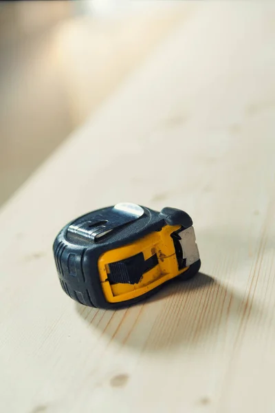 Carpenter Tape Measure Resting Rough Wooden Surface Board Ready Become — Stock Photo, Image