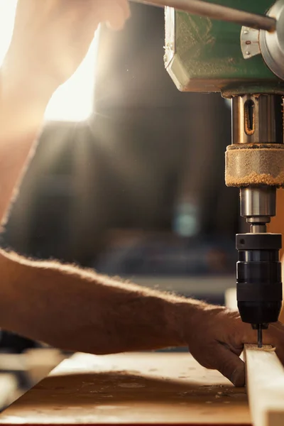 Carpenter Uses Drill Press His Workshop His Left Hand Taking — Stock Photo, Image