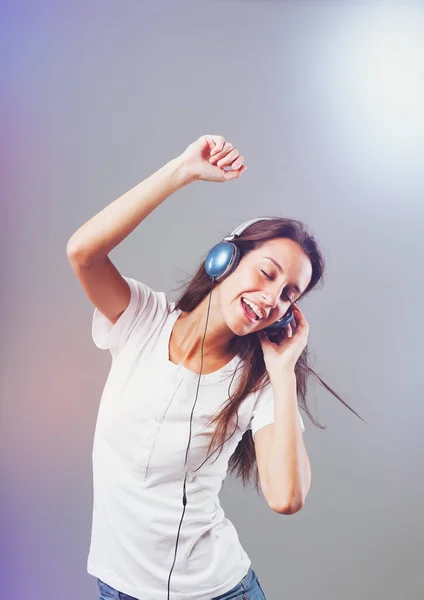 Girl Wearing Blue Headphones Listens Music Dancing Singing Surrounded Sparkling — Stock Photo, Image