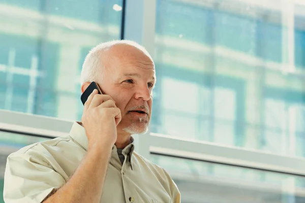 Older Executive Man Smartphone His Ear Talks Business Topics Very — Stock Photo, Image