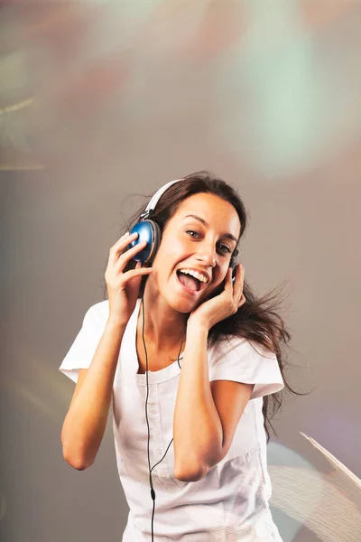 Girl Wearing Blue Headphones Listens Music Dancing Singing Surrounded Sparkling — Stock Photo, Image