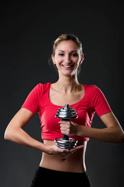 体操概念 伸展身体 女人自豪地将钢制的重量垂直地保持着 作为自力更生和努力的回报 — 图库照片