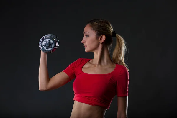 Fitness Passionate Blonde Lifting Weight Emphasizing Her Fit Stomach Red — Stock Photo, Image