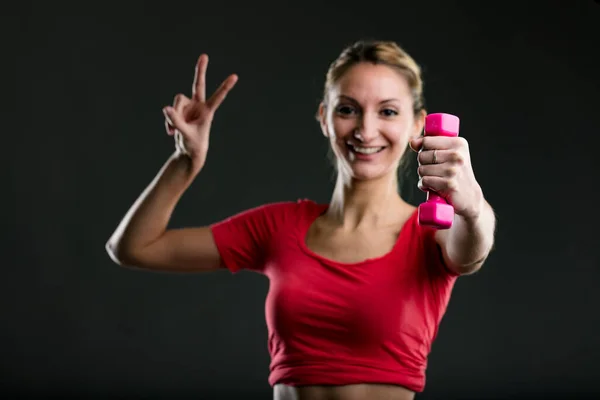 Woman Lifting Pink Dumbbell Giving Sign Smiling Blonde Red Top — Stock Photo, Image