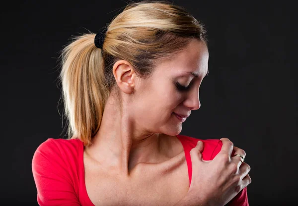 Shoulder Pain Woman Red Shirt Expressing Discomfort Grimacing Clutching Aching — Stock Photo, Image