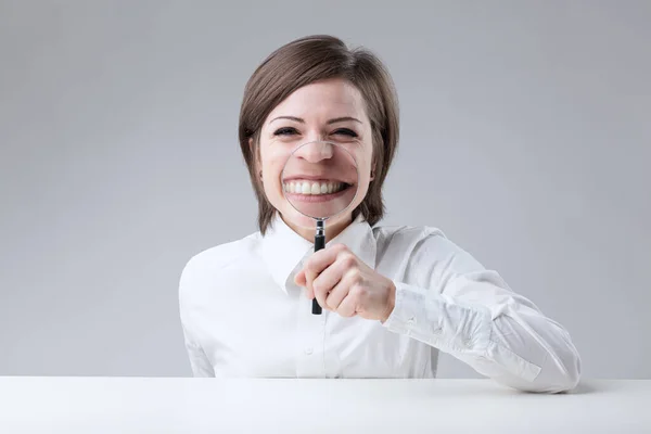 Woman exaggerates smile, big teeth