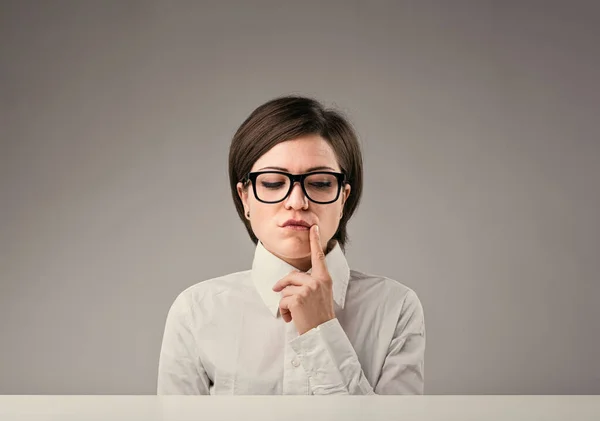 Doubtful Suspicious Woman Short Hair White Shirt Glasses Seated Desk — Stock Photo, Image