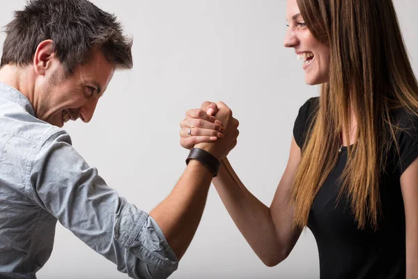 Man Woman Playfully Defiant Engage Arm Wrestling Embodying Dichotomy Friends — Stock Photo, Image