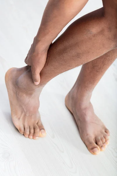 Detail Man Probing His Ankle Condition His Strong Legs Bare — Stock Photo, Image