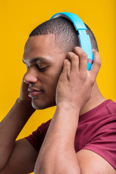 Man Passionately Listening Music Podcast Eyes Closed Gripping Blue Headphones — Stock Photo, Image
