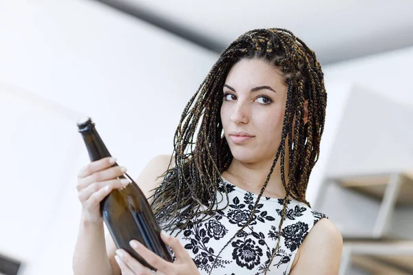 White Black Dress Box Braids Woman Proudly Presents Wine Bottle — Stock Photo, Image