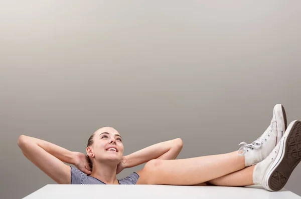 Sprawled Girl Feet Table Arms Headrest Gazes Upwards Dreamily She — Stock Photo, Image