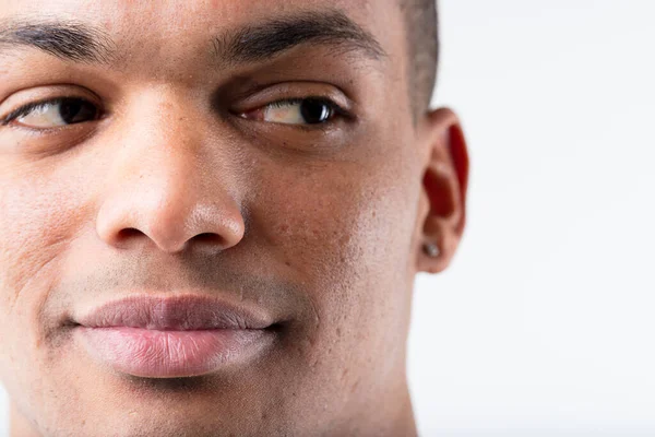 Close Portrait Young Smiling Black Man Cleverly Glancing Sideways Copyspace — Stock Photo, Image