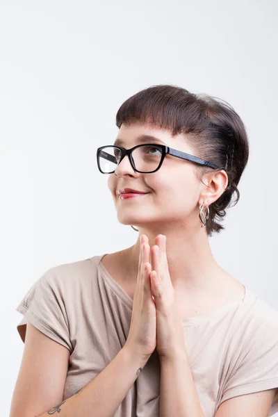 Woman Many Hairpins Glasses Joined Hands Sly Smile Feigns Innocence — Stock Photo, Image