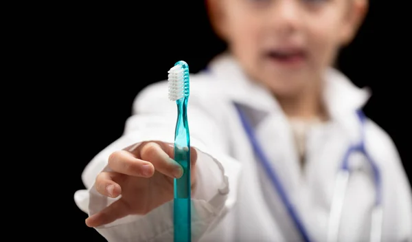 Small Blurry Girl Large Coat Playing Dentist She Holding Toothbrush — Stock Photo, Image