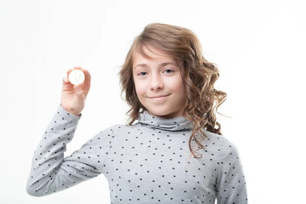 Polka Dotted Girl Displays Golden Coin Symbolizing One Euro Financial — Stock Photo, Image