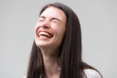 Center-front portrait of a joyous woman, who's laughing and smiling. She's wearing a formal white shirt, long hair, good teeth, emanating positivity and good news vibes clipart