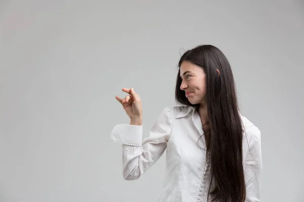 Slight Embarrassment Mingled Curiosity Young Woman Looks Sideways Making Gesture — Stock Photo, Image