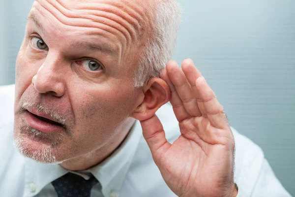 Mature Businessman Office Makes Hand Gesture His Ear Signifying All — Stock Photo, Image