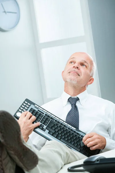 Office Senior Businessman Joyfully Pretends Play Computer Keyboard Guitar Feet — Stock Photo, Image