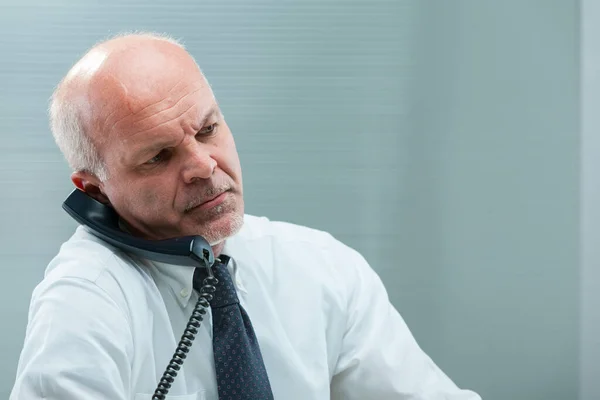 Senior Office Worker Struggles Understand Phone Call Holding Receiver Ear — Stock Photo, Image