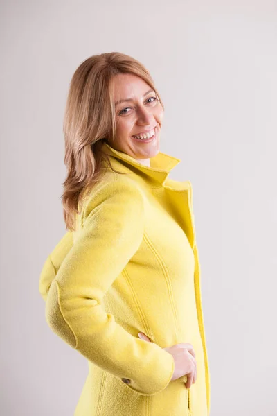 Merry Adult Woman Clad Yellow Coat Shows Flirtatious Smile Her — Stock Photo, Image
