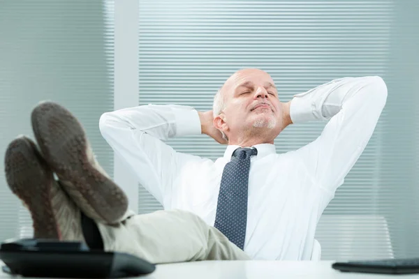 Mature Businessman Sits Relaxed His Desk Feet Arms His Head — Stock Photo, Image