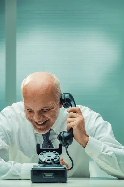Overwhelmed Laughter Mature Businessman Crouches Phone Pointing Antique Rotary Device — Stock Photo, Image