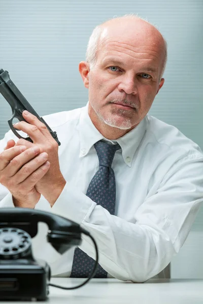 Nearly Bald Suited Man Phone Brandishes Gun Embodying Hitman Compromise Royalty Free Stock Images
