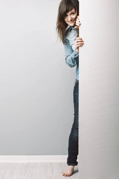 Curious Young Woman Denim Shirt Long Hair Peers Blue Toned — Stock Photo, Image