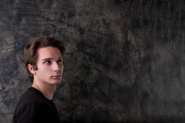 Black Shirt Man Stands Pondering Front Wiped Chalkboard Signifying Upcoming — Stock Photo, Image