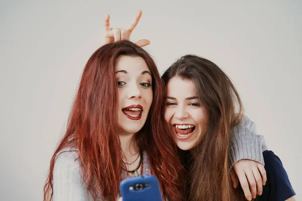 Perfectly Groomed Yet Playful Two Young Women Make Amusing Faces — Stock Photo, Image