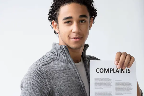 Holding Sheet Labeled Complaints Individual Face Carries Hint Determination Mixed — Stock Photo, Image